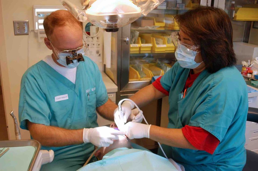 Picture of two dentists working on a patient