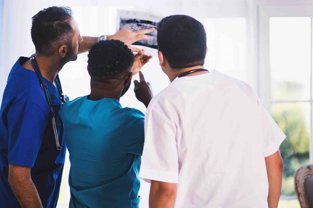 Dentists consulting on an x-ray