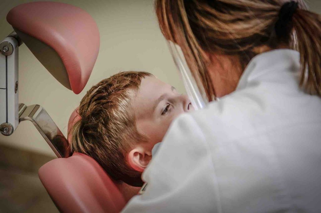 Child getting a checkup from the dentist